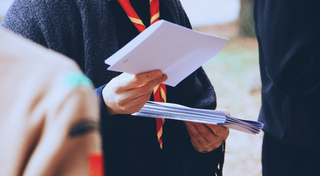 A man holding a letter with a focused expression. The letter represents a Nexus Letter, a crucial document in VA disability claims. A Nexus Letter is a medical opinion from a doctor that connects a veteran’s current disability to their military service, helping strengthen their case for benefits.