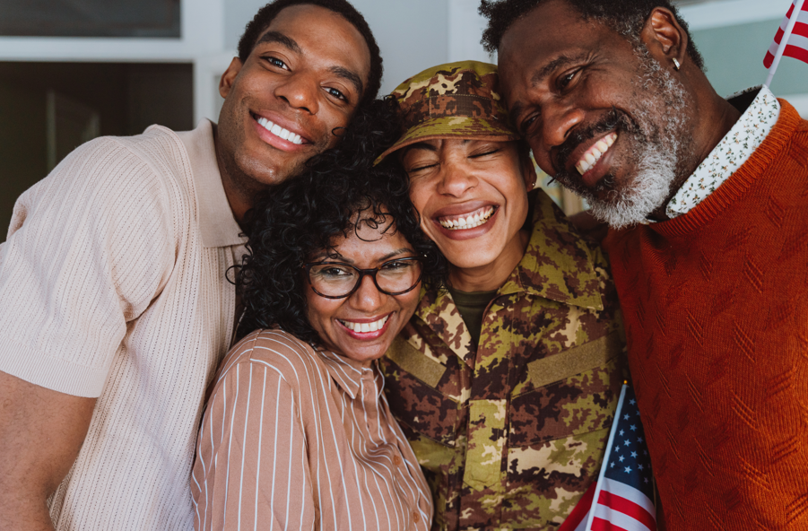 A smiling veteran with family.