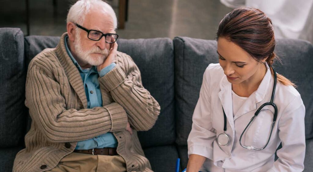 A man engages in a clinical conversation with a psychologist — a moment that captures the beginning phase of an Independent Psychological Evaluation (IPE)