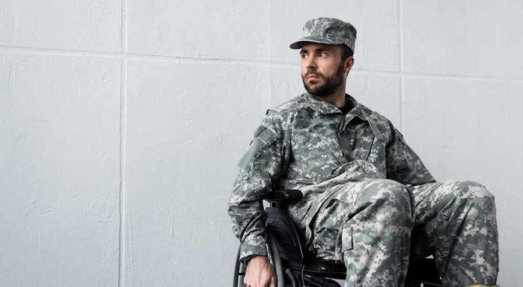 A soldier in a wheelchair powerfully represents the impact of service-connected conditions that may qualify a veteran for Total Disability Individual Unemployability (TDIU) benefits.