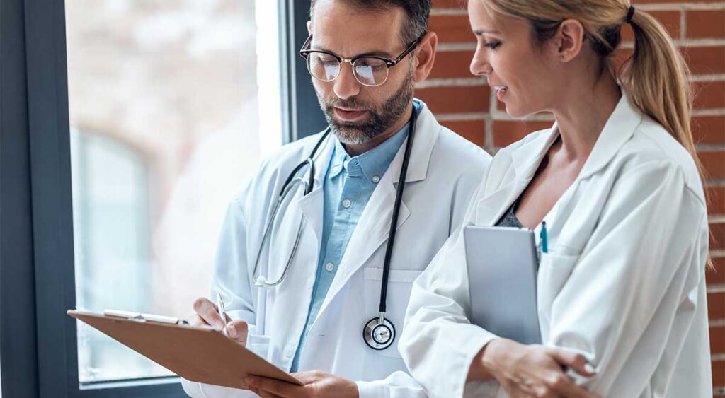 Doctors reviewing medical evidence—underscoring the vital role strong documentation plays in supporting veterans’ claims. Learn why investing in quality evidence makes all the difference.