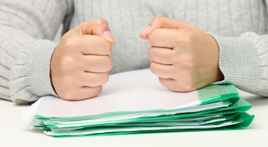 Clenched fists reflect the frustration veterans feel when VA exams fall short. Without strong independent evidence, claims can be denied—highlighting the need for expert support beyond the VA system.